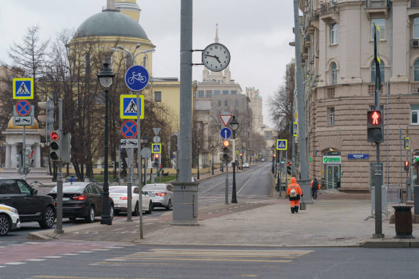 Moscow, Russia - March 30, 2020:: Almost no people at the streets in spring time. Concepts - Stay at home, save live. Concepts of social distancing and self-isolation. Coronavirus Pandemic lifestyles