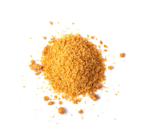 istock Brown cane sugar isolated on white background. top view 1215948319