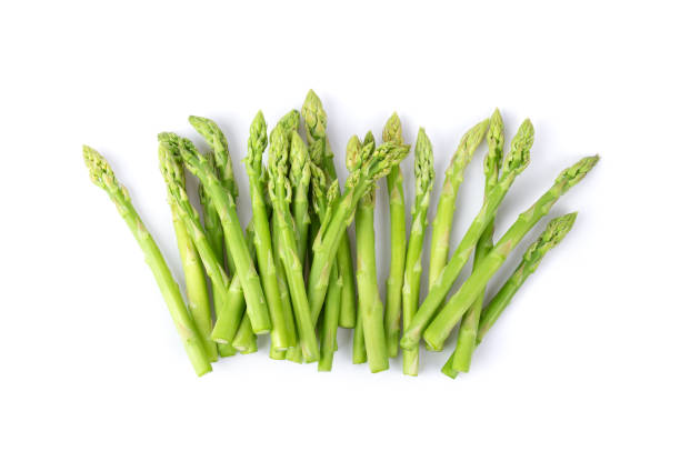 istock Asparagus isolated on white background. top view 1215948914
