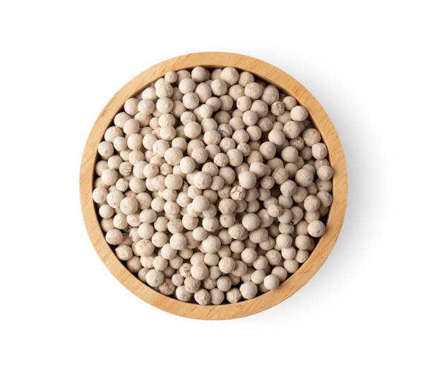 istock white peppercorn isolated on white background. top view 1215948969