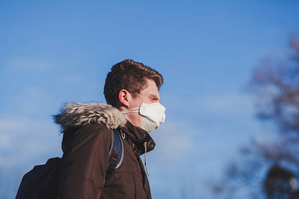 istock Attractive man with medical mask 1215951708