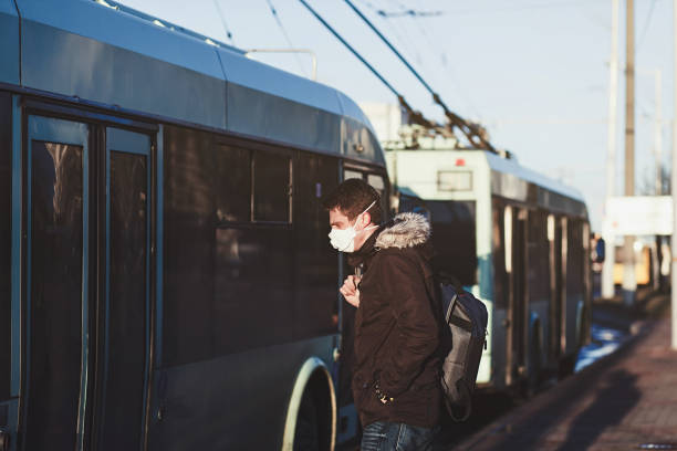 istock Young man wearing protective mask against transmissible infectious diseases 1215951755
