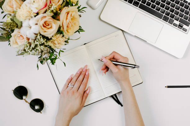 istock Woman work on laptop. Office desk workspace with computer, flowers, sunglasses. Flat lay, top view work business hero header background. 1215952343