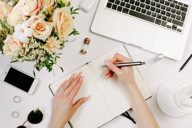 istock Woman work on laptop. Office desk workspace with computer, flowers, sunglasses. Flat lay, top view work, business hero header background. 1215952710