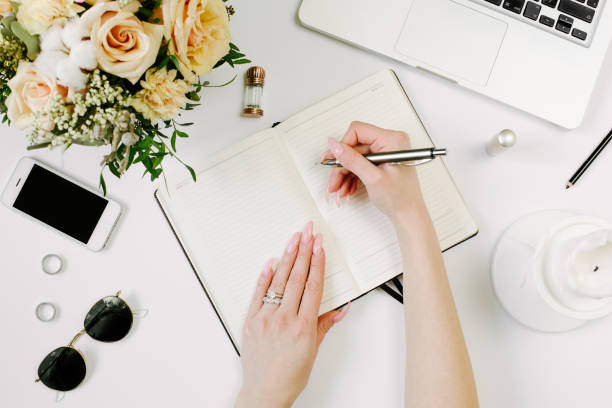 istock Woman work on laptop. Office desk workspace with computer, flowers, sunglasses. Flat lay, top view work, business hero header background. 1215953780