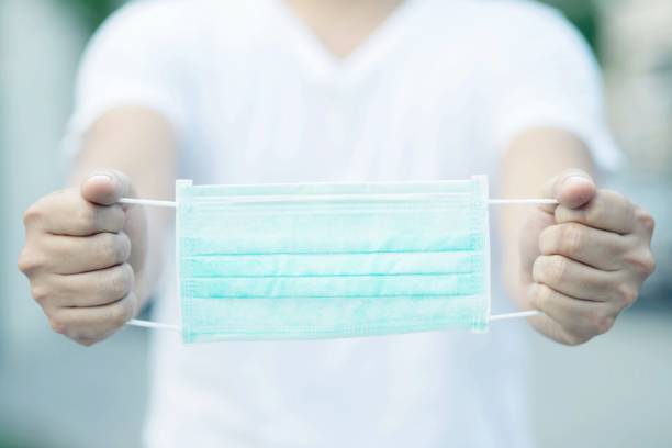 istock Help each other wear a mask to prevent the virus. 1215954795