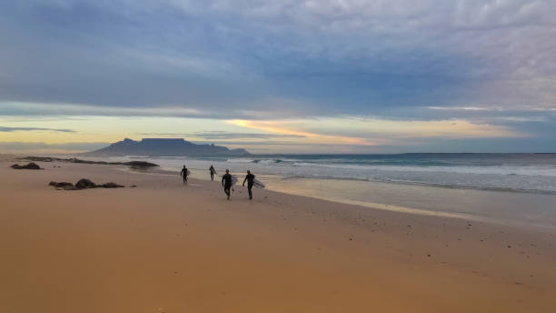 istock Group of Surfers Cape Town beach 1215955017