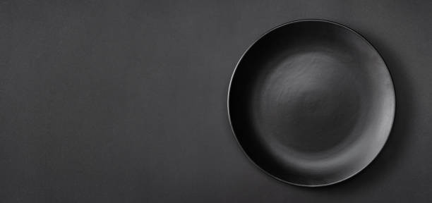 istock Long banner with black plate on black background 1215955654