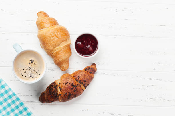 istock Breakfast with coffee and croissants 1215955764