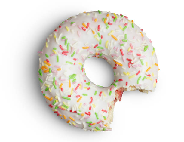 istock Bitten doughnut with sprinkles on white wih clipping path 1215955790