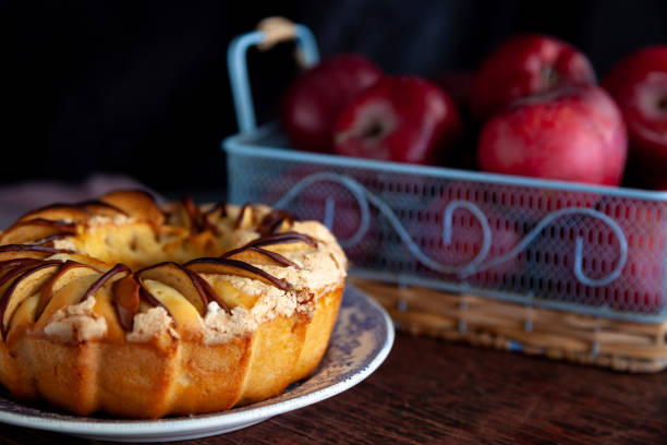 istock Round apple pie. Homemade pastries. Cupcake with apples on a wooden table. Simple food 1215958708