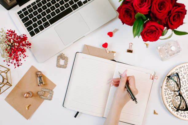 istock Woman work on laptop. Office desk workspace with computer, roses, glasses. Flat lay style. Freelance and remote work concept 1215958733