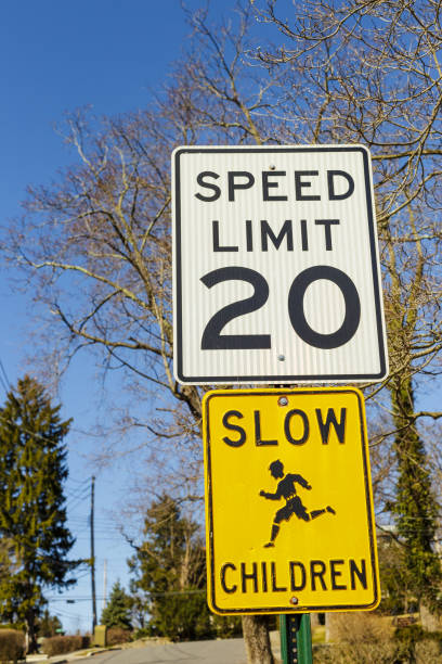 istock Road sign displaying 20 mph speed limit warning 1215963137