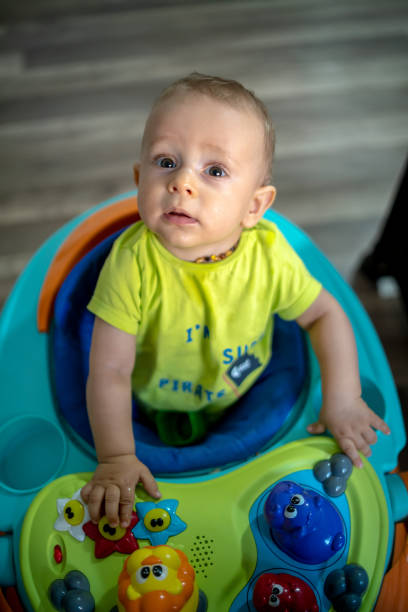 istock First steps of the boy in a baby walker 1215968505