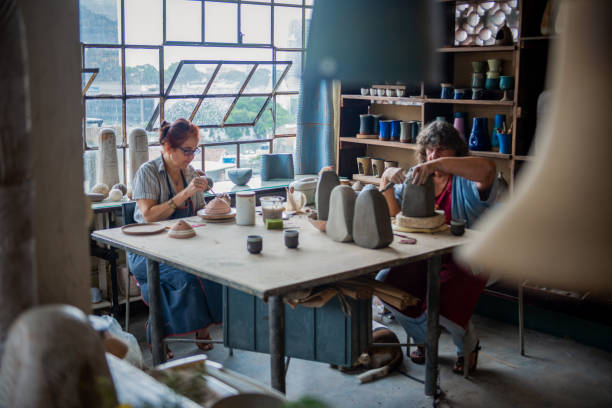 istock Women making pottery indoors 1215969472