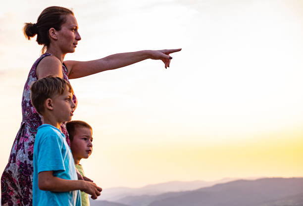istock Brothers with mom in nature 1215970054
