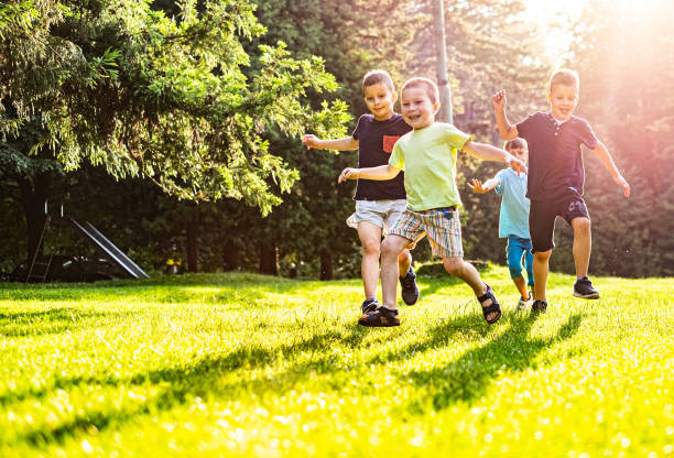 istock Group of children running 1215970774