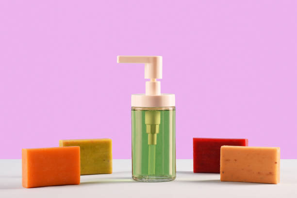 istock Soap concepts, Soap dispenser and multi colored soap bars 1215971374