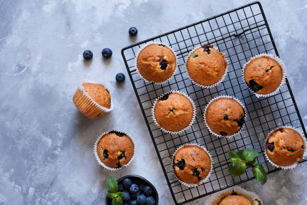 istock Vanilla muffins with blueberries on a concrete background. View from above. 1215971606