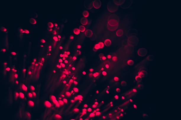 istock Beautiful optical abstract red bokeh in the darkness background. 1215972061