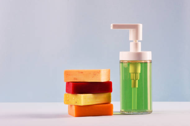 istock Soap concepts, Soap dispenser and multi colored soap bars 1215972241