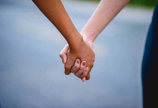 istock Holding hands with each other is an expression of love. Love concept 1215972586