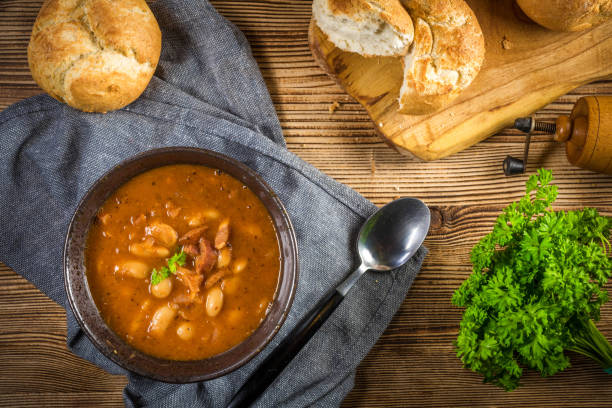 istock Beans with tomato sauce, bacon and sausage. 1215972864