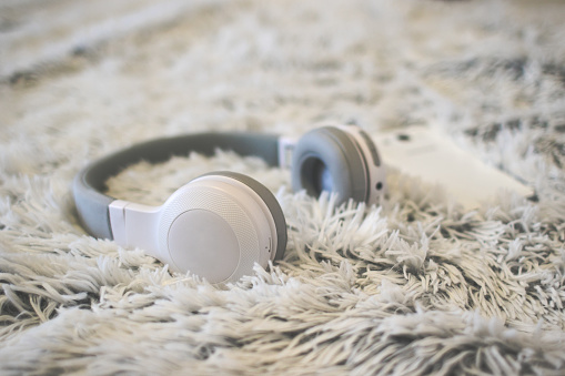 White headphones on bed
