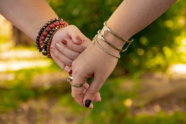 istock close female hand holding 1215977244