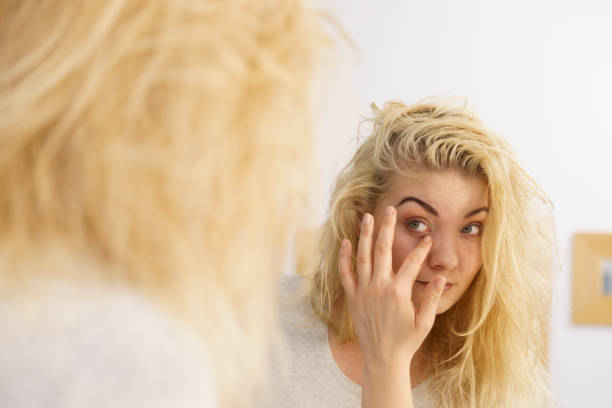 istock Woman feeling tired in bathroom 1215977336