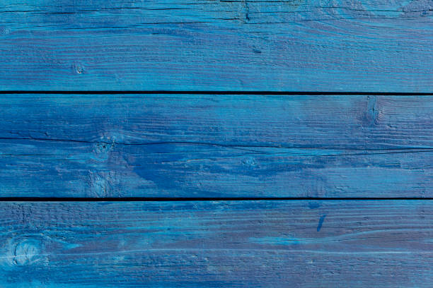 istock Old blue wooden background with cracks and stripes 1215977401