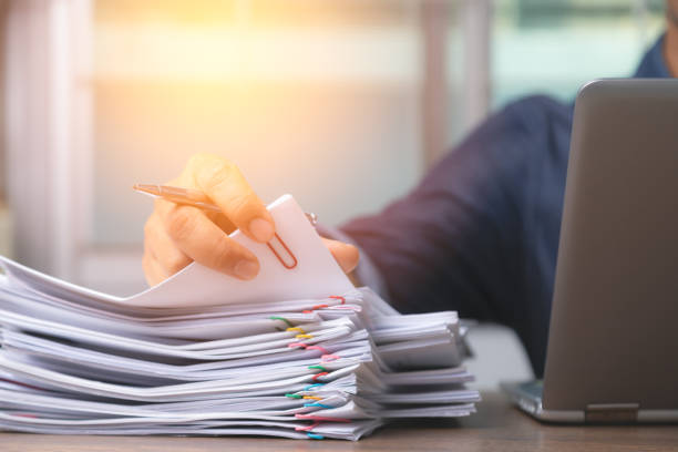 istock Man hand with pen Picking document For working from home, concept of social distancing coronavirus covid-19. 1215978745