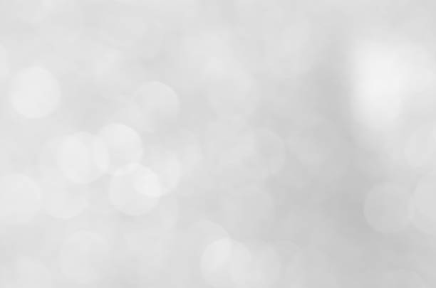 istock abstract white blur bokeh glitter sparkle no color background. 1215979610