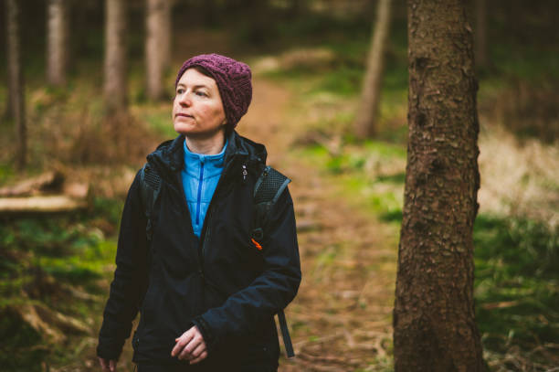 istock Carefree Woman in forest 1215979912