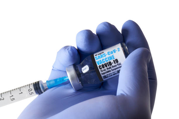 istock Vaccine: Covid-19, Coronavirus in vial with syringe on white background. 1215988359