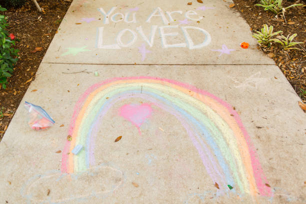 istock Covid-19 Inspirational Sidewalk Chalk Art 1215989011