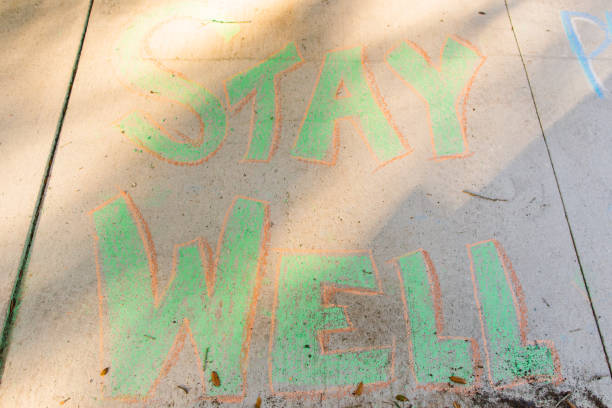 istock Covid-19 Inspirational Sidewalk Chalk Art 1215989492