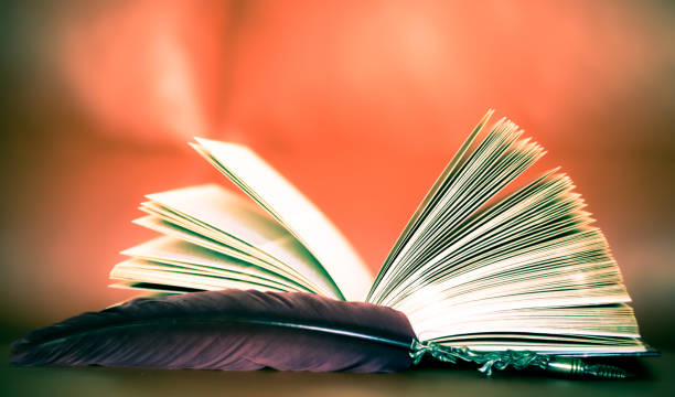istock an old book and an old liquid ink pen 1215989797