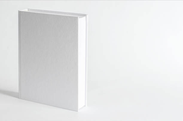 istock Mockup of closed blank square book at white textured paper background 1215990657