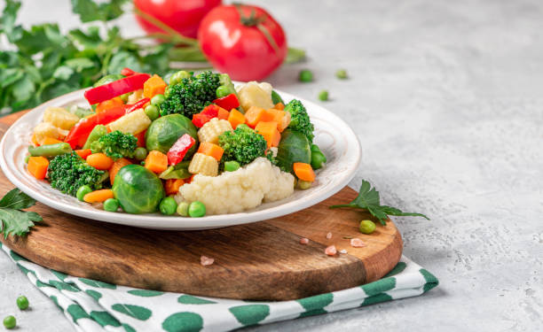 istock Mix of stewed vegetables in a ceramic plate on the served table. 1215991589