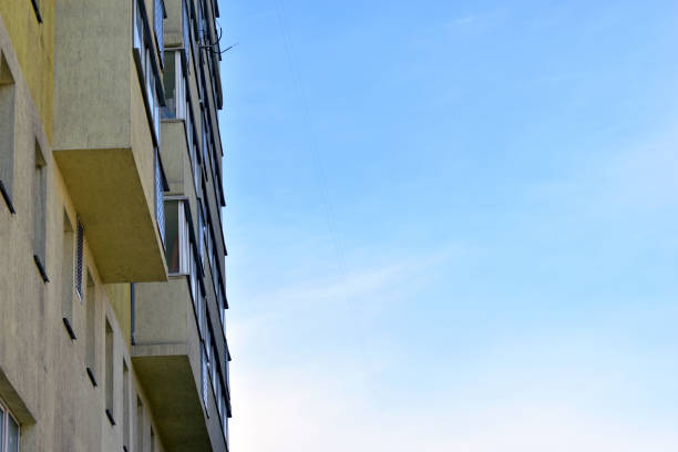 istock Yellow high-rise building against a blue sky 1215997839