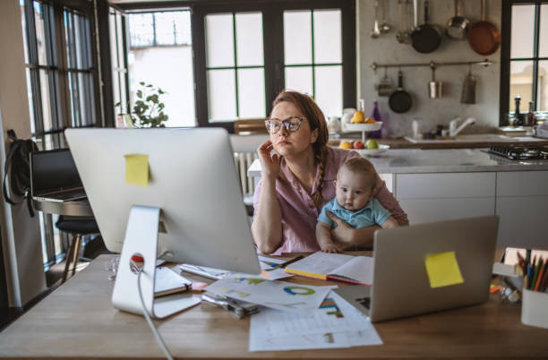 istock Mother with baby working from Home 1215997926