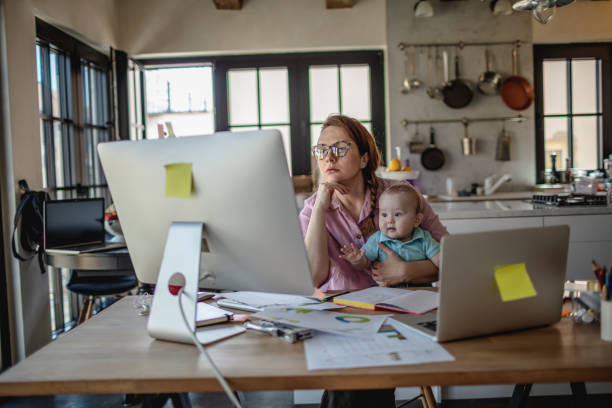 istock Mother with baby working from Home 1215998106