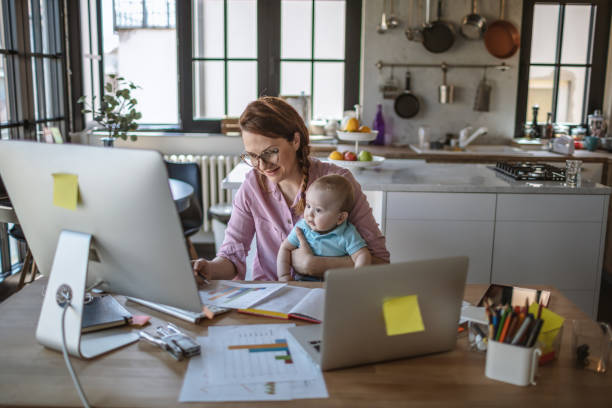 istock Mother with baby working from Home 1215998195