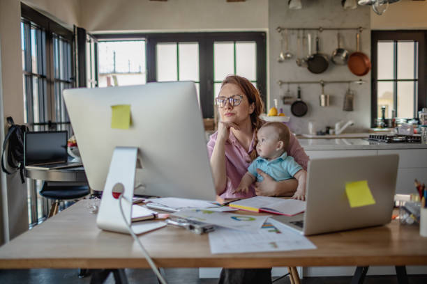 istock Mother with baby working from Home 1215998841