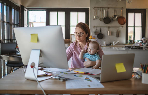 istock Mother with baby working from Home 1215998984