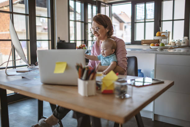 istock Mother with baby working from Home 1215999263