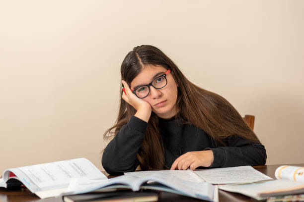 boring homework pictures young girl tired of studying young girl tired of studying boring homework twelve stock pictures, royalty-free photos & images