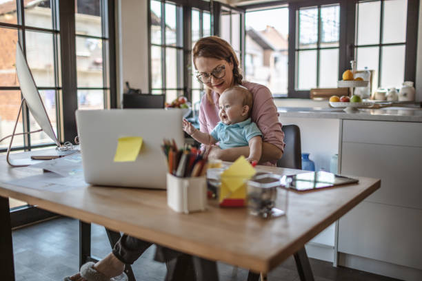 istock Mother with baby working from Home 1215999364