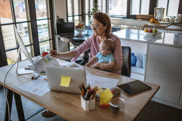 istock Mother with baby working from Home 1215999592